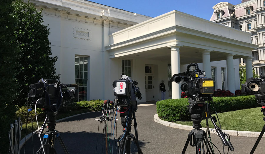 The White House with television cameras outside