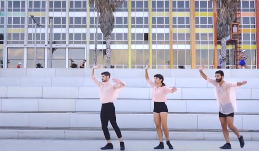 People dancing in a city square