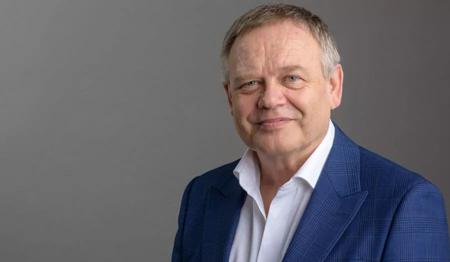 man wearing suit, smiling