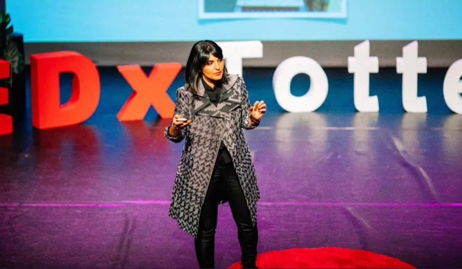 woman speaking at a TED Talk