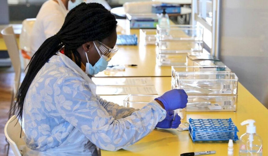 a woman undertaking a coronavirus test