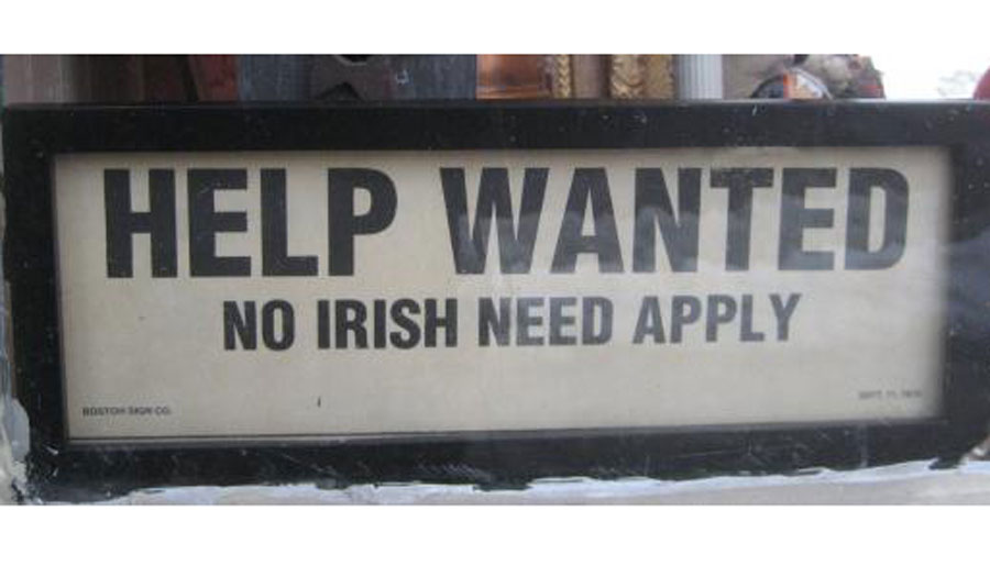 sign reading 'help wanted: no Irish need apply'