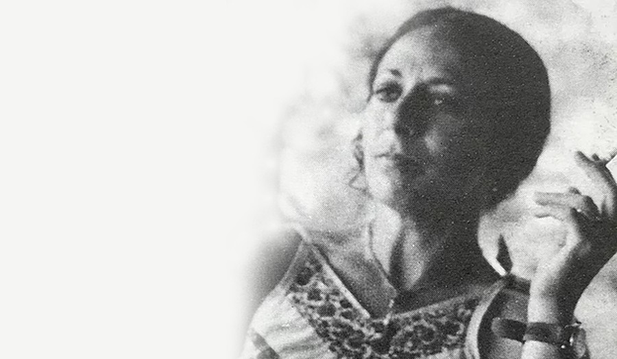 old fashioned photo of a woman smoking a cigarette