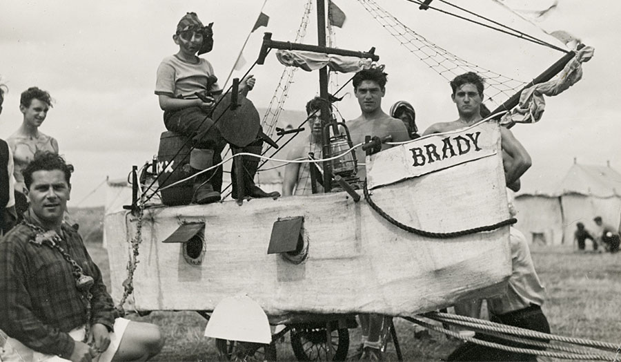 Group of young men on a homemade ship on bicycle wheels