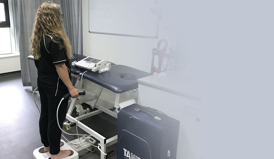 woman standing on a body composition analyser