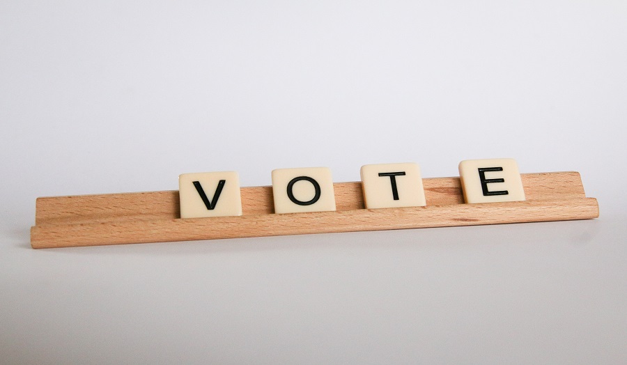 Scrabble tiles spelling out 'VOTE'