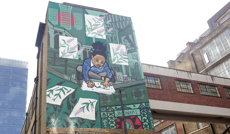 mural of young girl drawing flowers