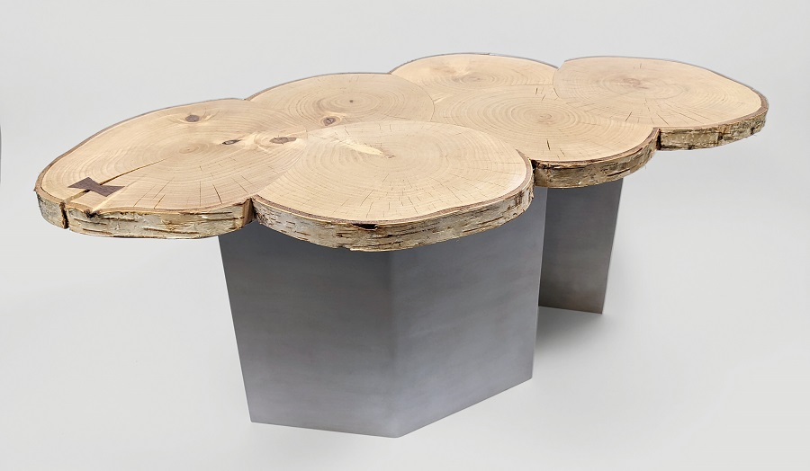 a table with a top made of sliced log