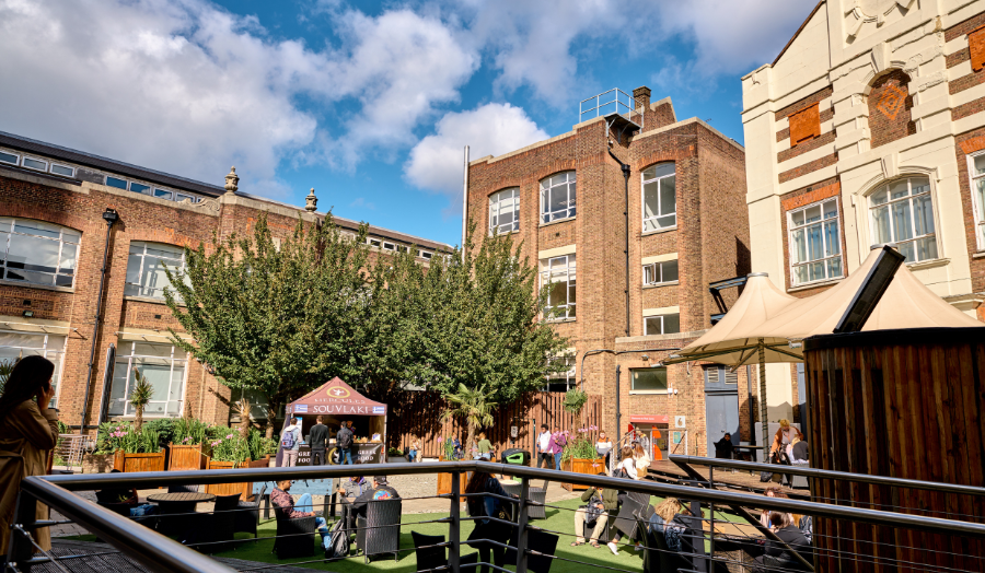 London Met's courtyard replete with food stalls and revellers