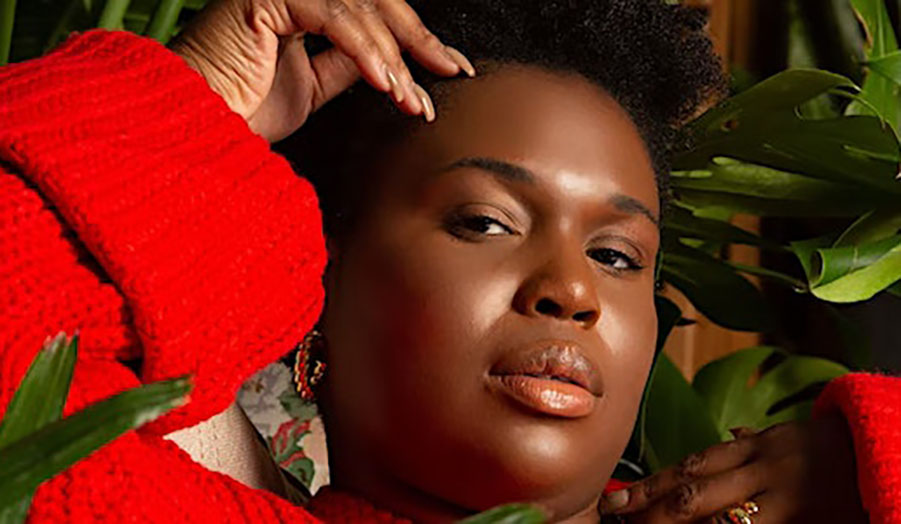 A portrait of a young woman in red jumper