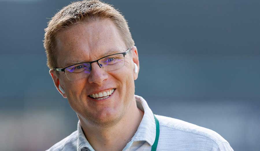 Man with glasses and short hair smiling