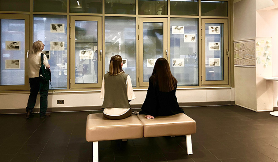Two people look at the exhibition