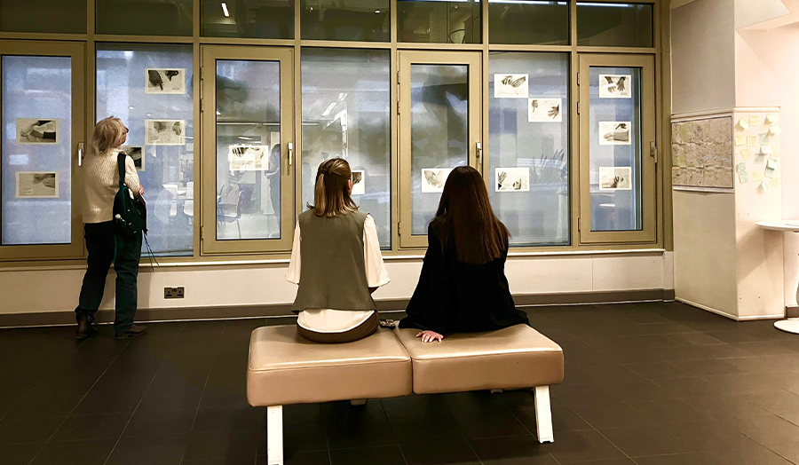 Two people look at the exhibition 