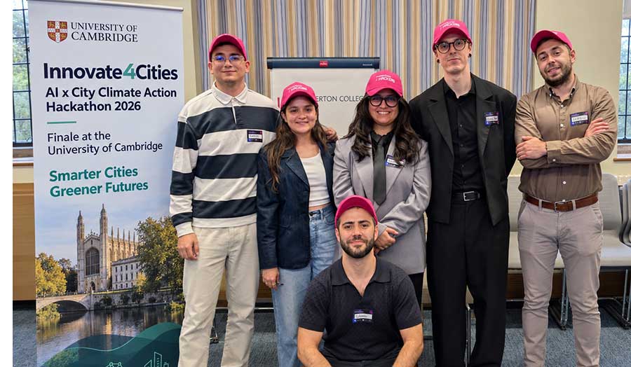 London Met student team standing nexto a sign