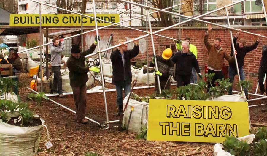 people at a community project withe large banners