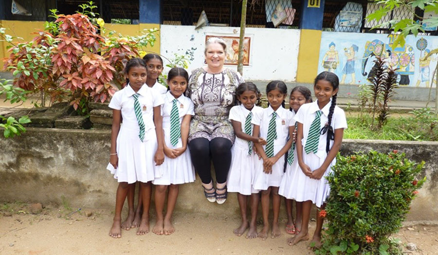 Image of Hazel Messenger and students in Sri Lanka