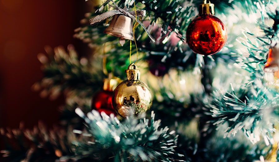 Christmas tree with baubles on it.