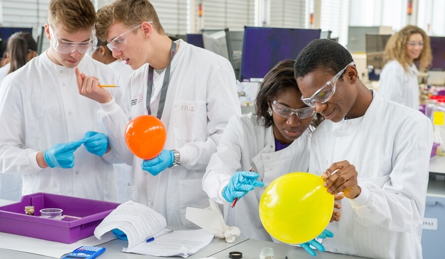 Summer school students working in science lab