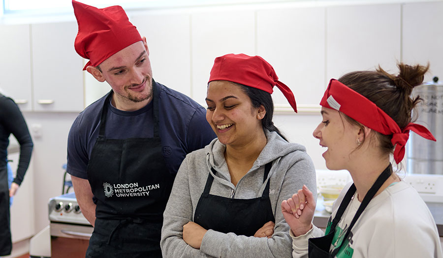 Dietetics and nutrition students in the food labs smiling
