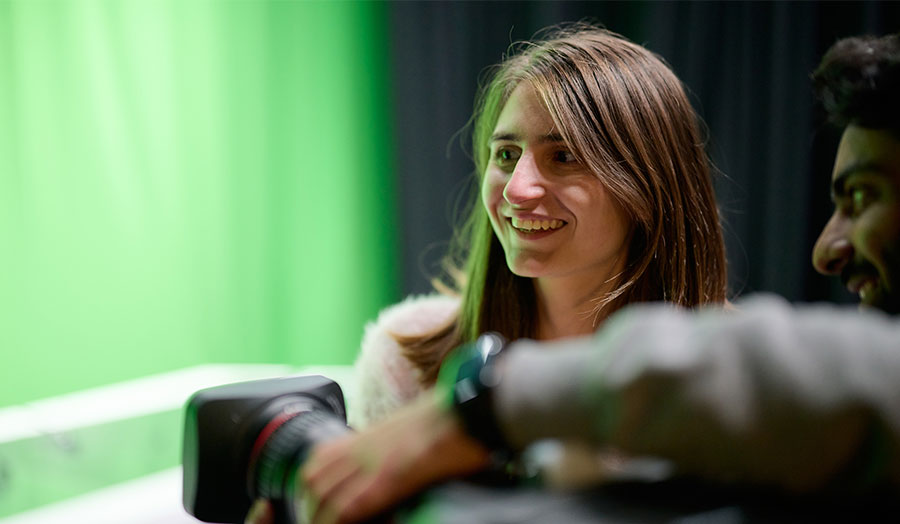 London Met student Stefani with another student experimenting with a green screen