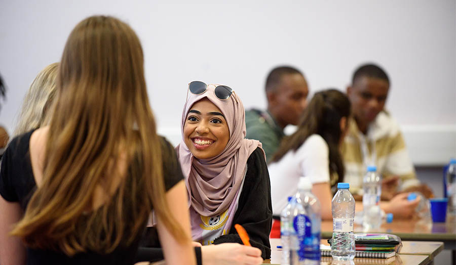 Two students discussing a project in the classroom