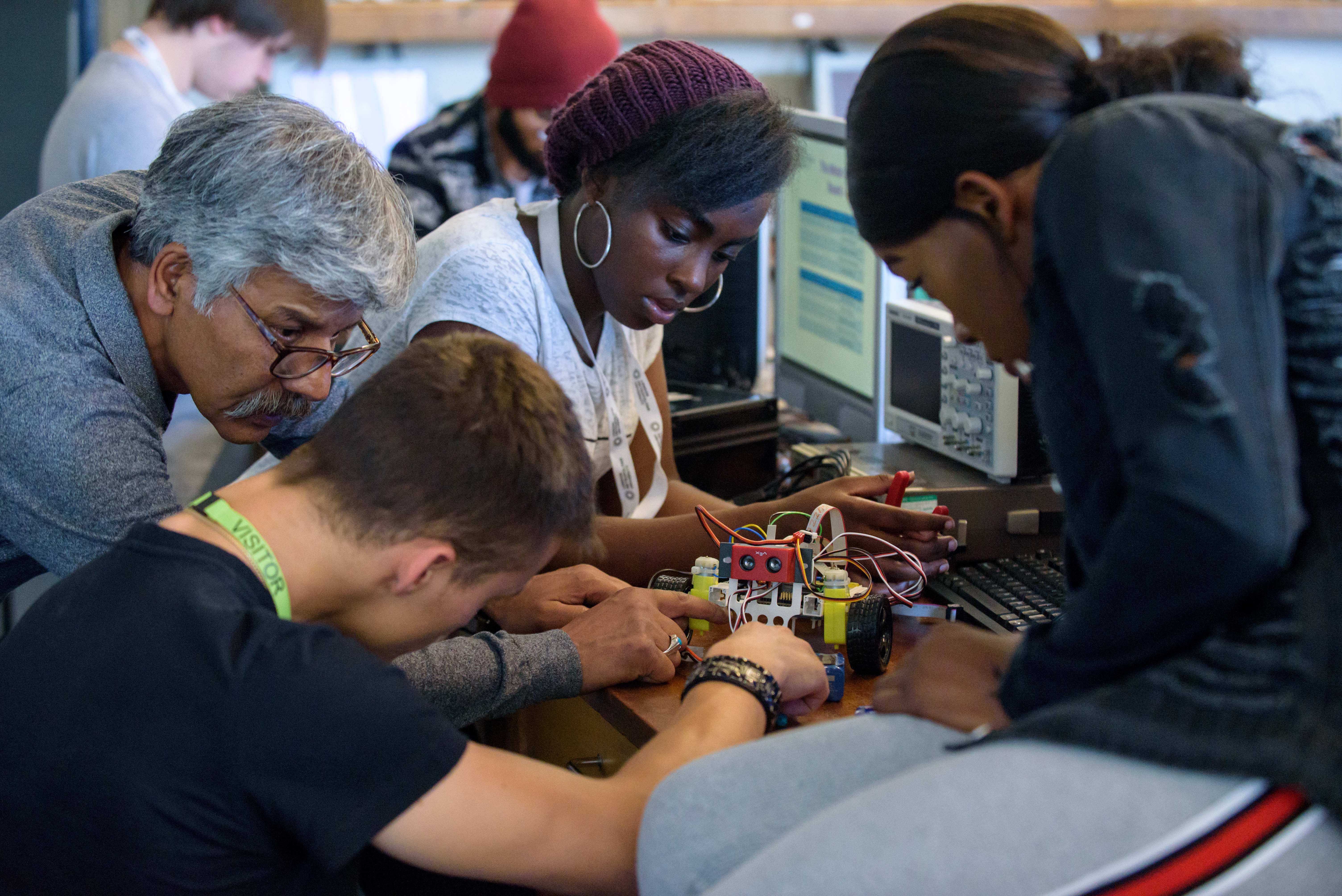 A member of the academic staff working with students on the hands-on project.