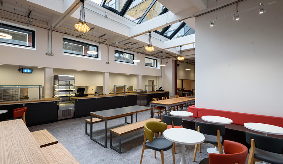 New and modern hot food counter, tables and chairs in Highbury Canteen