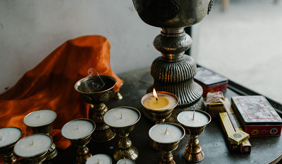 Small candles on a table as an offering