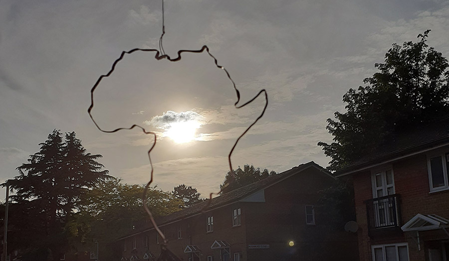 A silhouette of Africa made of thin metal rope