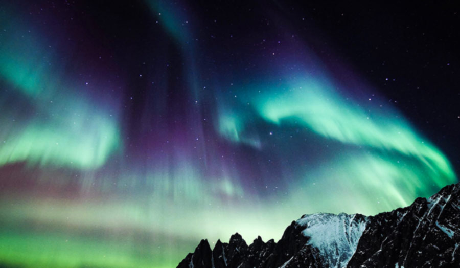 A sky with the spectacular lights of the Northern Lights