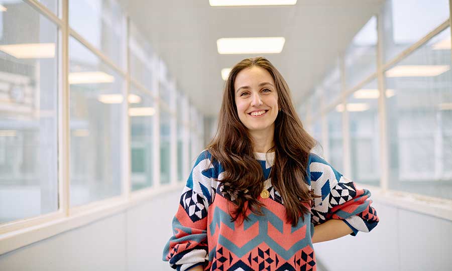 Alessia Dalceggio standing in the corridor at the Holloway campus smiling at the camera
