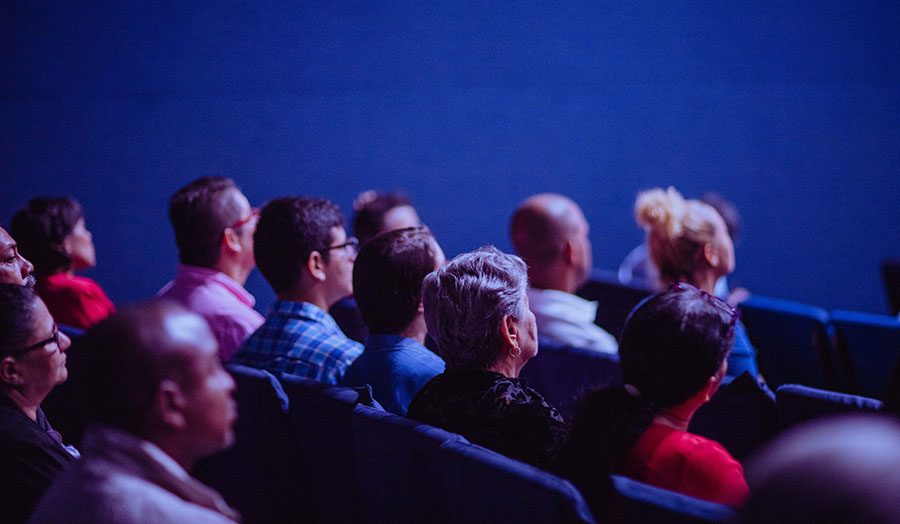 a group of people with their backs to the viewer at the event