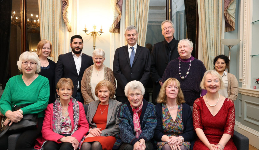 Group photo of different gender people in the Irish Embassy. 