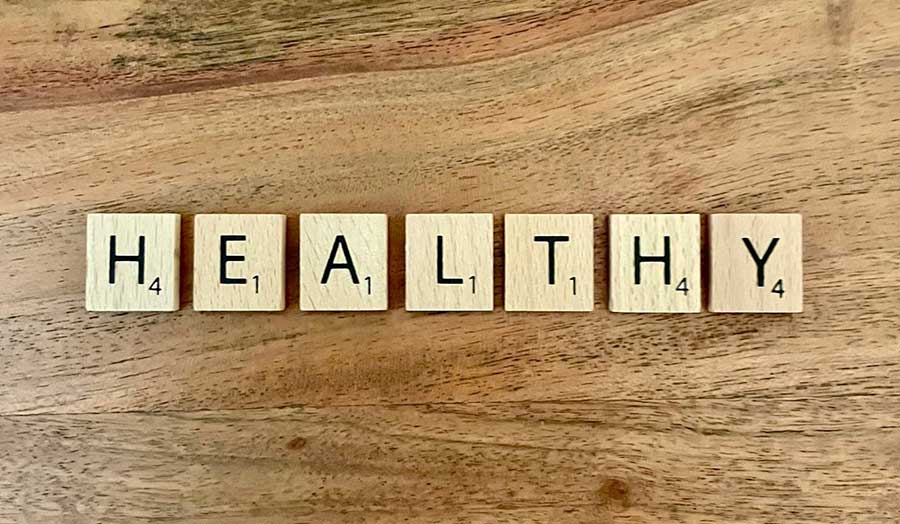 Scrabble tiles spell out the word "healthy"