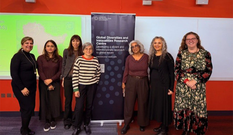 A group of people smile at the camera