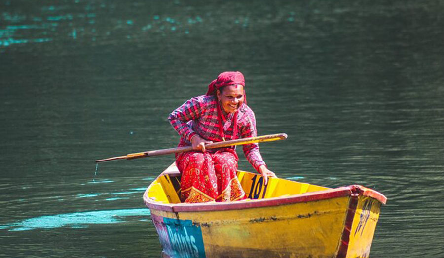 A fisherwoman in a boat