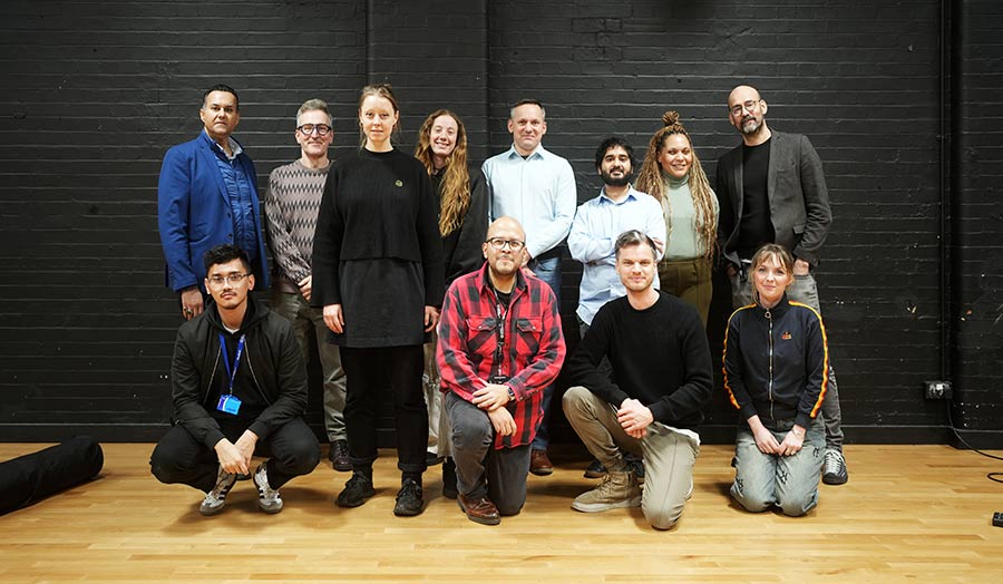 A group of people pose together 