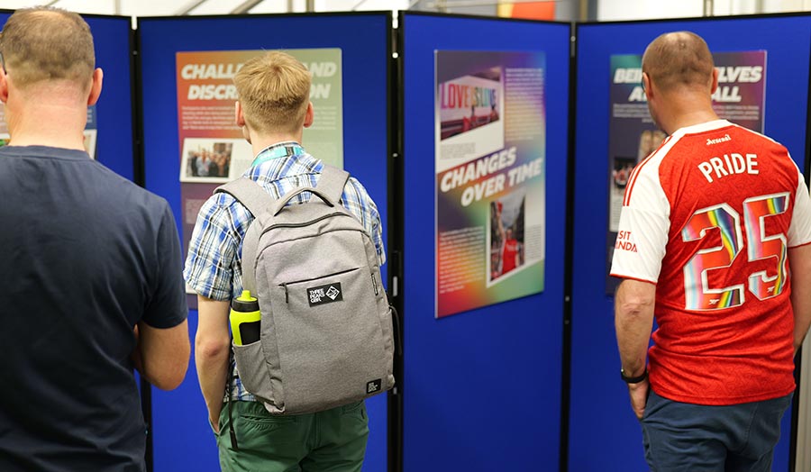 People look at posters at an event