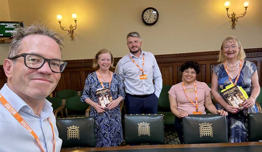 A group of people smile at the camera