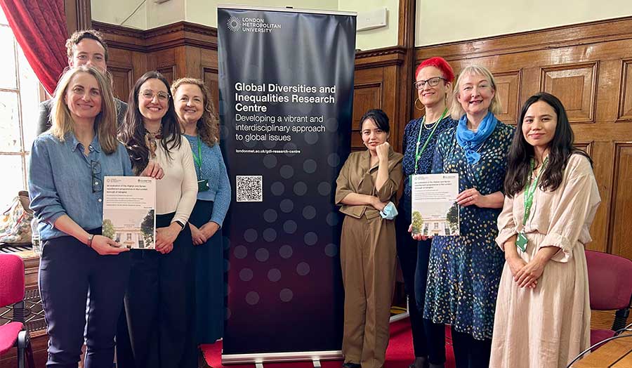 Members of the project team holding reports