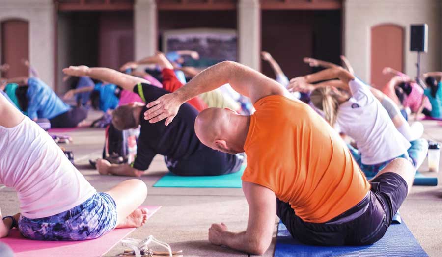 A group of people stretching in an exercise class