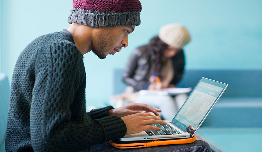 Male Student on Laptop for live chat page