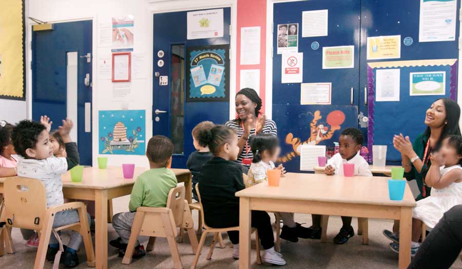 Teacher working with students in a classroom