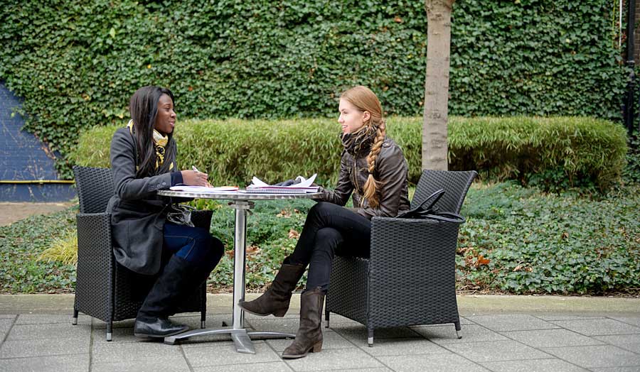 Two students studying outside