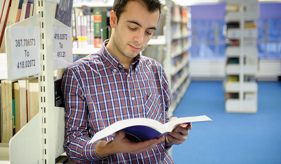 Male student in the Calcutta House library