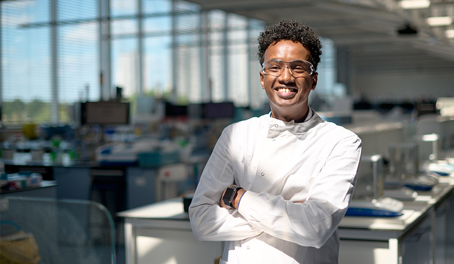 Abdulahi pictured smiling in the Superlab as he returned to campus for a visit