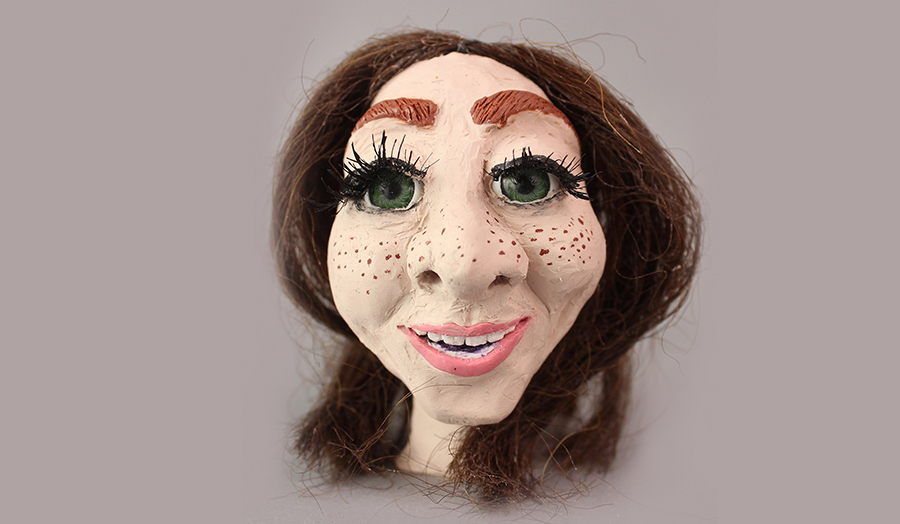 Clay model self-portrait of Aga
