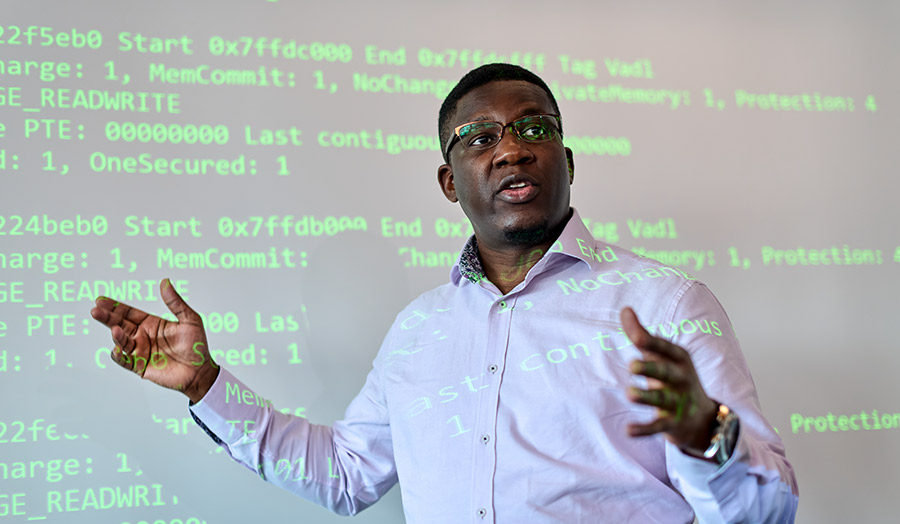 Dipo lecturing with computing code in the background