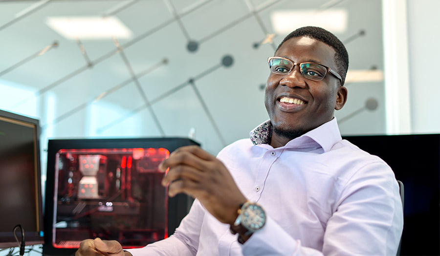 Dipo Dunsin, PhD student in computing pictured in the cyber security research centre