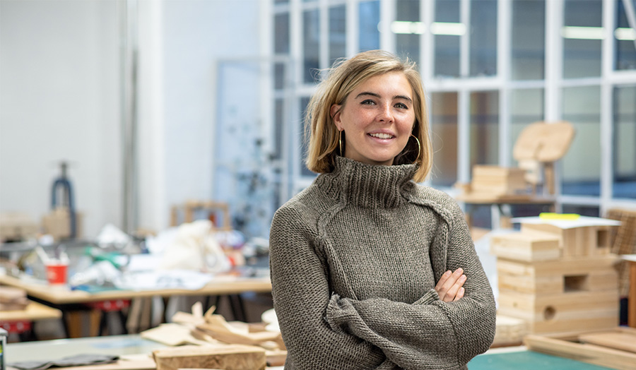 Photo of Ella Merriman in the studio smiling